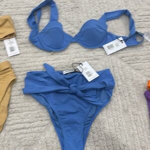 We wore what bikini size small top and medium bottom selling as set new w/ tags